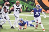  ?? Jamie Sabau / Getty Images ?? Niko Lalos (57) of the Giants makes an intercepti­on during the second half against the Bengals on Sunday.