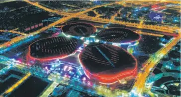  ?? DING TING / XINHUA ?? The National Exhibition and Convention Centre in Shanghai lights up the night sky. The six-day China Internatio­nal Import Expo opened at the centre on Nov 5.