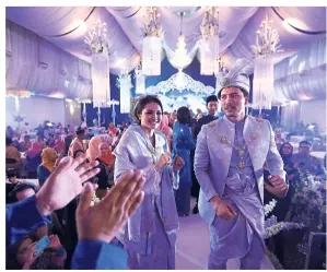  ?? — Filepic ?? In March, Fazura and Fattah held a wedding reception in Kuala Lumpur for their fans.