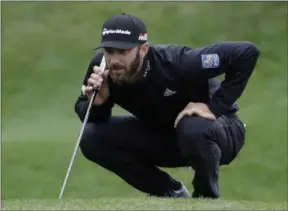  ?? LYNNE SLADKY - THE ASSOCIATED PRESS ?? Dustin Johnson lines up a putt on the second hole during the final round of The Players Championsh­ip golf tournament Sunday, March 17, 2019, in Ponte Vedra Beach, Fla.