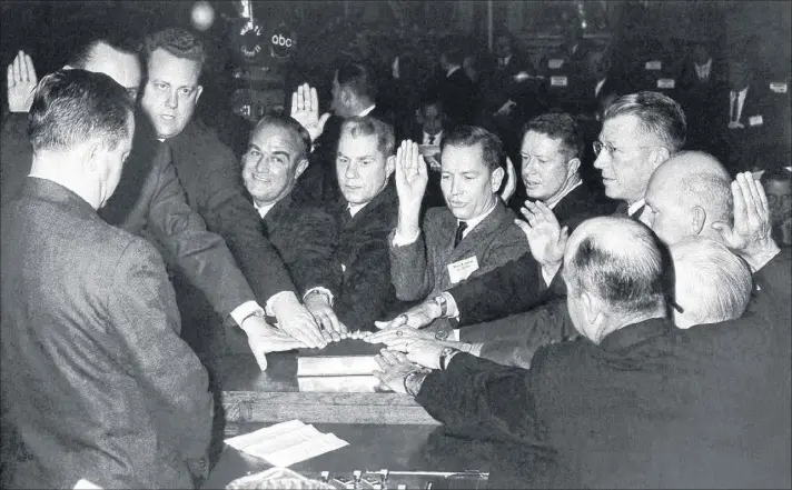  ?? ASSOCIATED PRESS PHOTOS ?? Jimmy Carter, (fifth from right), is sworn in as state senator on Jan. 14, 1963. Carter said he walked into the chambers with trepidatio­n that day, not sure if he would be sworn in because his election was at the center of a bitter legal dispute over...