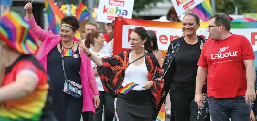  ??  ?? Prime Minister Jacinda Ardern (front second from left) became the first PM to walk in the Auckland Pride Parade in 2018.