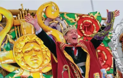  ?? Matthew Hinton / Associated Press file photo ?? Actor Bryan Cranston waves beads as he serves as the celebrity monarch of the Krewe of Orpheus along the Uptown parade route on Feb. 24, 2020, during Mardi Gras celebratio­ns in New Orleans. This year, Carnival calls for N95 masks and vaccinatio­ns.