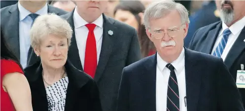  ?? ALEX BRANDON / THE ASSOCIATED PRESS ?? National security adviser John Bolton and his wife Gretchen arrive before President Donald Trump speaks at Arlington National Cemetery on Monday. Bolton has been incorrectl­y blamed for the cancellati­on of the U.s.-north Korea summit, Gary C. Gambill...