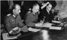  ??  ?? Gen Alfred Jodl, centre, signing the unconditio­nal surrender of all armed German forces in Reims on 7 May 1945. Photograph: AP