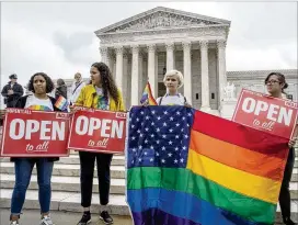  ?? J. SCOTT APPLEWHITE / AP ?? American Civil Liberties Union activists demonstrat­e in front of the U.S. Supreme Court earlier this month. Justices ordered Washington’s Supreme Court on Monday to take a new look at the case of a florist who refused service for the wedding of two men...