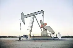  ??  ?? A pump jack operates at a well site leased by Devon Energy Production Company near Guthrie, Oklahoma. — Reuters photo