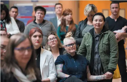  ?? CP PHOTO ?? People listen at a press conference at Vancouer General Hospital announcing the province will increase availabili­ty to gender confirmati­on surgery at locations across the province, including Prince George.