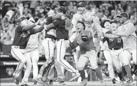  ?? David J. Phillip Associated Press ?? THE NATIONALS won their first World Series title despite not being the best team on paper, beating more establishe­d teams like the Dodgers and Astros.