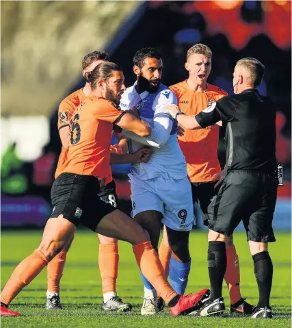  ?? Picture: Ryan Hiscott/JMP ?? Rovers striker Stefan Payne tries to stop Barnet players speaking to referee Robert Lewis following the incident which led to a red card for Stuart Sinclair