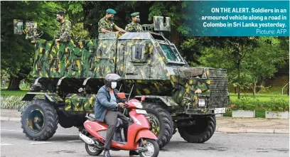  ?? Picture: AFP ?? ON THE ALERT. Soldiers in an armoured vehicle along a road in Colombo in Sri Lanka yesterday.