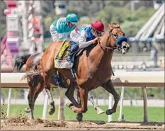  ?? Associated Press ?? Taiba and jockey Mike Smith, outside, overpower Messier and jockey John Velazquez to win the Santa Anita Derby.