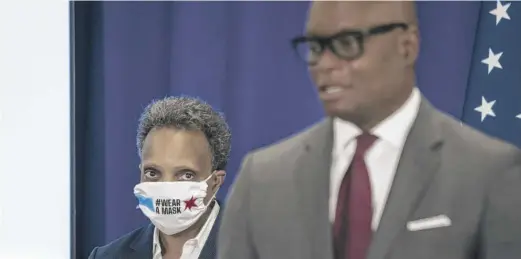  ?? ASHLEE REZIN GARCIA/SUN-TIMES ?? Mayor Lori Lightfoot looks on as Chicago Police Supt. David Brown speaks last week.