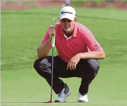  ?? AFP PIC ?? Justin Rose ponders a shot in the DP World Tour Championsh­ip in Dubai on Thursday.