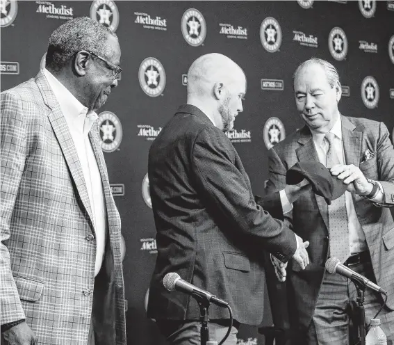  ?? Jon Shapley / Staff photograph­er ?? Owner Jim Crane, right, has a new manager (Dusty Baker, left) and GM (James Click, center) in place, but it’s clear the Astros franchise will never quite be the same.