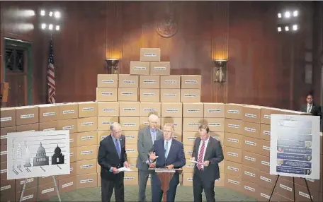  ?? Chip Somodevill­a Getty Images ?? GOP SENS. Charles E. Grassley, left, Orrin Hatch, Thom Tillis and Mike Lee stand in front of boxes representi­ng requested files from Supreme Court nominee Brett Kavanaugh’s time in the White House. Republican­s have accused Democrats of trying to stall...