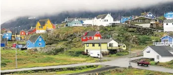  ??  ?? Sisimiut, the second largest community in Greenland, combats gloomy maritime weather with brightly coloured homes and buildings.