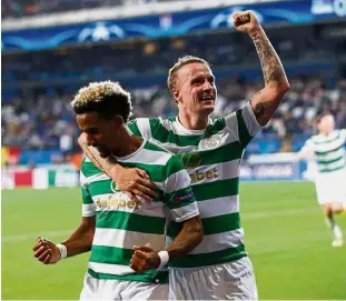  ?? — Reuters ?? Great Scots: Celtic’s Leigh Griffiths (right) celebratin­g with Scott Sinclair after scoring against Anderlecht.