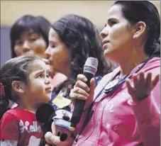  ?? Don Bartletti Los Angeles Times ?? PARENT Maria Isabel Perez, with daughter Leslie, 3, describes what she wants from the next superinten­dent. More than 100 meetings were scheduled, with fewer than 12 people on average at each event.