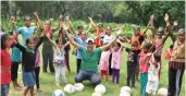  ??  ?? Peter with his students at the football academy.