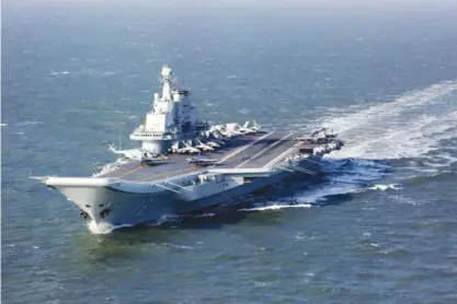  ?? —AFP ?? BEIJING: This file photo shows China’s aircraft carrier Soviet-era Liaoning.