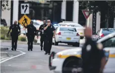  ?? AP ?? Police outside the shopping and dining centre in Jacksonvil­le, Florida, after receiving reports of the shootings