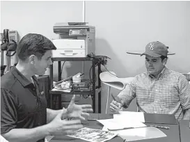  ?? Sunnova Energy photos ?? Sunnova CEO John Berger, left, talks with Puerto Rican Gov. Ricardo Rosselló about his Houston-based company’s effort with solar and battery systems to alleviate the sweeping power outage caused by Hurricane Maria.