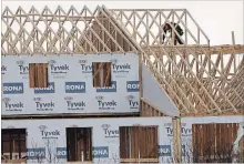  ?? CLIFFORD SKARSTEDT EXAMINER ?? Crews work at a housing developmen­t underway in the city’s north end Friday.