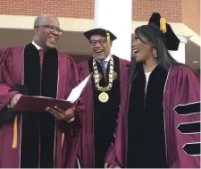  ?? AP ?? ‘BURDEN HAD BEEN TAKEN OFF’: Robert F. Smith, left, laughs with David Thomas, center, and actress Angela Bassett at Morehouse College on Sunday in Atlanta.