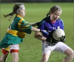  ??  ?? Sarah Nolan of Barntown holds off Aisling Ní Ghogáin (Gaelscoil).