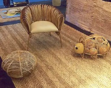  ??  ?? Armchair and ladybug decor in rattan and metal by Finali, ottoman in rattan by Basket &amp; Weaves, abaca carpet by WeaveManil­a