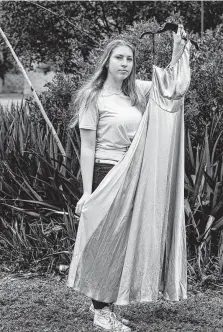  ?? Photos by Josie Norris / Staff photograph­er ?? Sarah Mason, 17, displays her prom dress at Reagan High School, whose prom was canceled because of the city of San Antonio’s restrictio­ns on gatherings amid the pandemic.