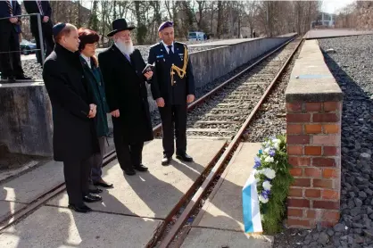  ?? (Illustrati­ve; Thomas Peter/Reuters) ?? RECITING THE kaddish prayer at a memorial at Grunewald railway station in Berlin, where Jews were deported to concentrat­ion camps. In the book, a key character-atheist says kaddish for the father, but feels nothing.