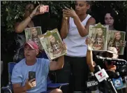 ?? ?? supporters of Gabby petito hold up photos of Gabby after a news conference Wednesday.