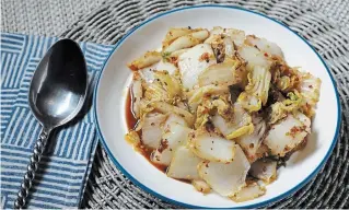  ?? ABEL URIBE
CHICAGO TRIBUNE ?? Chopped cabbage is stir-fried with chile crisp, soy sauce, vinegar, sesame oil and garlic. It works as a side dish or a main served with rice.