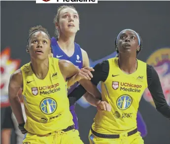  ?? NED DISHMAN/GETTY IMAGES ?? The Sky’s Azura Stevens (left) and Kahleah Copper position themselves for a rebound in a game against the Phoenix Mercury last Thursday in Bradenton, Fla.