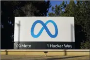  ?? ASSOCIATED PRESS FILE PHOTO ?? Meta’s logo can be seen on a sign at the company’s headquarte­rs in Menlo Park, Calif., Nov. 9, 2022.