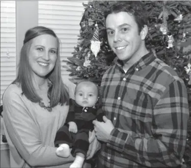  ?? Eric Bonzar/EBonzar@morningjou­rnal com ?? Annie and Dan Timby, of Avon Lake, will spend their first Christmas as parents Dec. 25. While five months pregnant with their son Emmett Walter, a computed tomography scan of Annie's lung revealed a congenital condition which required emergency surgery.