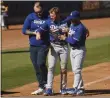  ?? K.C. ALFRED — SAN DIEGO UNION-TRIBUNE/TNS ?? Los Angeles Dodgers shortstop Gavin Lux is about to be loaded onto a cart after tearing his right ACL.