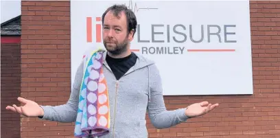  ??  ?? ●Coun Mark Roberts outside Romiley Leisure Centre, which remains closed to the public