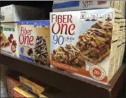  ?? CANDICE CHOI — THE ASSOCIATED PRESS ?? Fiber One bars sit on a shelf at a market, in New York. Snack bars, cereals and brownies with added fiber may not appear as filling under a new labeling rule. A littledisc­ussed aspect of the revamped Nutrition Facts panel, which was postponed Tuesday, June 13, is that it could change what ingredient­s products like Fiber One bars can count as dietary fiber. The unsettled details are partly why the industry has called for delaying the deadline to use the new panel.