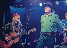  ?? SUZANNE CORDEIRO FOR AMERICAN-STATESMAN ?? Willie Nelson joins his old friend Billy Joe Shaver onstage at the Luck Reunion in March at his ranch in Spicewood.