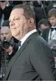  ?? GETTY-AFP 2013 ?? A representa­tive for Hollywood mogul Harvey Weinstein, above, denied the three allegation­s of rape.