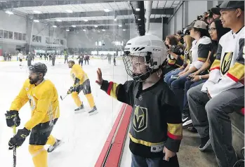  ?? ETHAN MILLER/GETTY IMAGES/FILES ?? Jacob Kotter of Nevada watches Vegas Golden Knights players practise in May. Many NHL teams are investing in practice facilities that can also be used by the public.