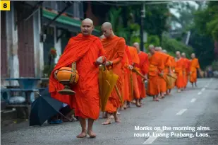  ?? ?? Monks on the morning alms round, Luang Prabang, Laos.