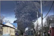  ?? GENE J. PUSKAR — THE ASSOCIATED PRESS FILE ?? A black plume rises over East Palestine, Ohio, as a result of a controlled detonation of a portion of the derailed Norfolk Southern trains on Feb. 6.