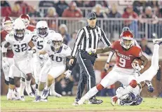  ?? [PHOTO BY BRYAN TERRY, OKLAHOMAN ARCHIVES] ?? Oklahoma’s CeeDee Lamb eludes the TCU defense during the Sooners’ win in Norman last season.