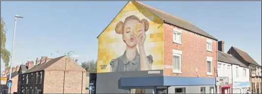  ??  ?? ■ The “Orange Lady” mural on the corner of Ashby Road and Hastings Street, Loughborou­gh, which was painted by local artist Buber Nebz back in 2017. Image Google Street View