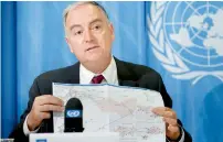  ?? — AP ?? Panos Moumtzis shows a Syria’s map to the media during the Press conference in Geneva, Switzerlan­d, on Monday.