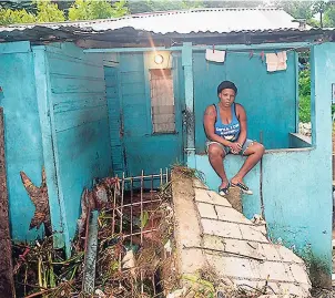  ?? PHOTO BY ADRIAN FRATER ?? Roxanne Bennett sits on what remains of her house on King Street in Montego Bay, St James, after all her belongings were washed away in the flood rains.